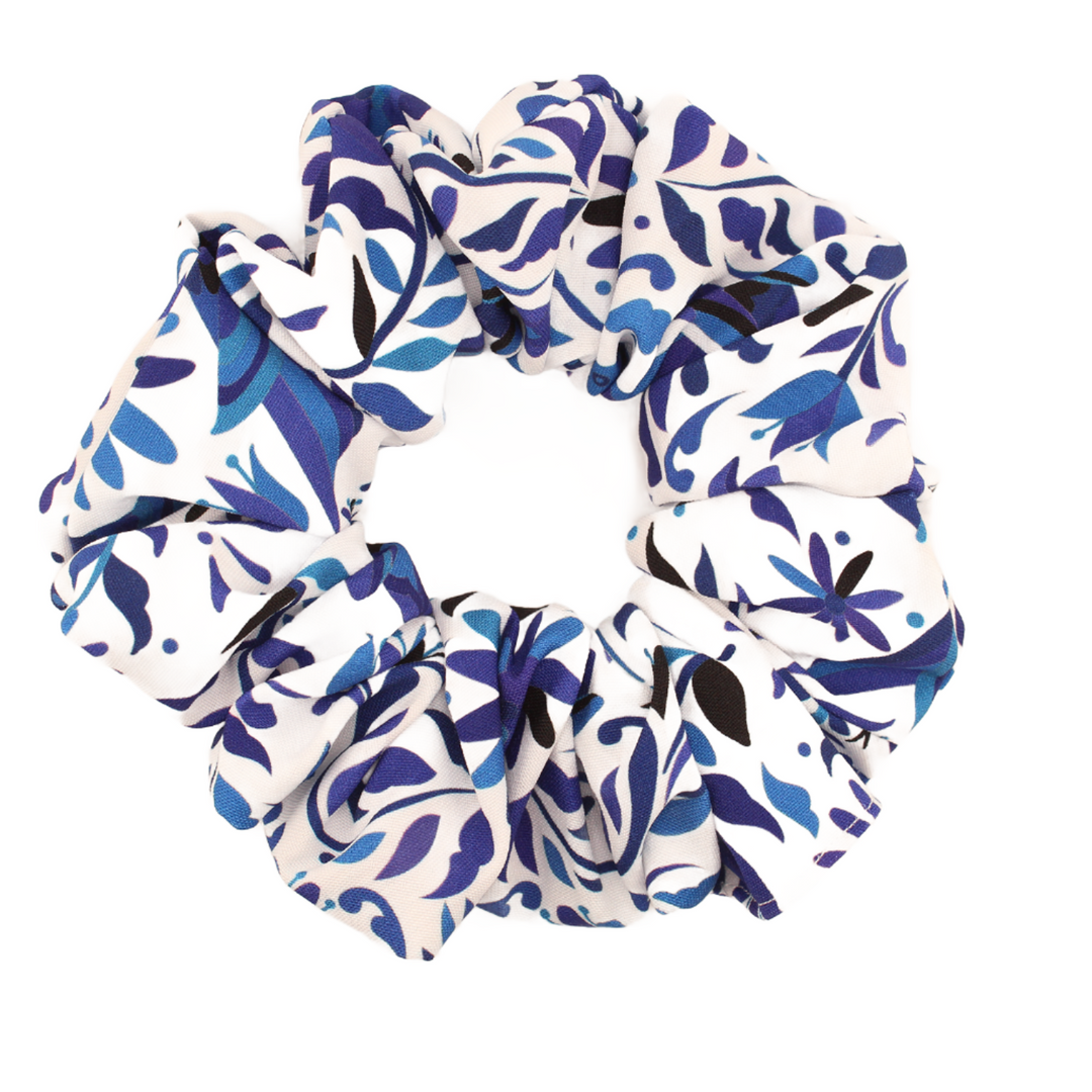 Add a fiesta flair to your hair with our scrunchies, featuring traditional Mexican patterns! Dive into a world of vibrant designs and discover the perfect scrunchie to reflect your personality.  Embrace stunning beauty with our Talavera-inspired scrunchie, a tribute to the traditional hand-painted clay pottery of Puebla, Mexico. Its unique design and rich cultural heritage will make you look and feel amazing.